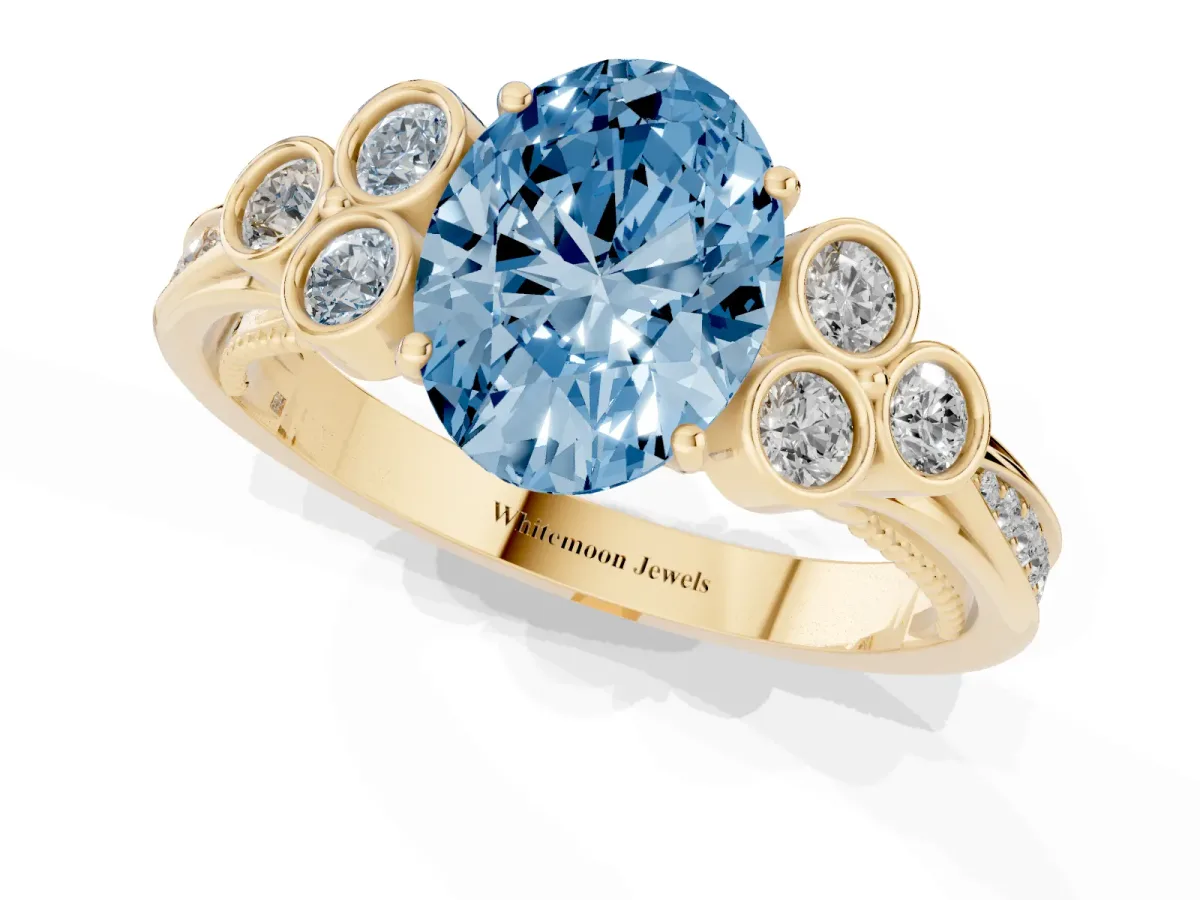 Fancy Blue Oval Cut Cut Diamond Engagement Ring with Bezel Set Round Side Stones and Prong Setting Yellow gold