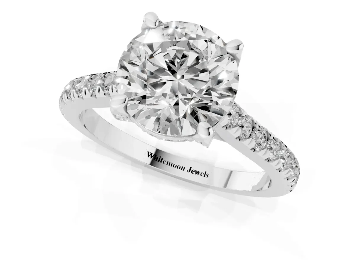 Round Cut Brilliant Diamond Solitaire with Pavé Band and Four-Prong Setting Silver