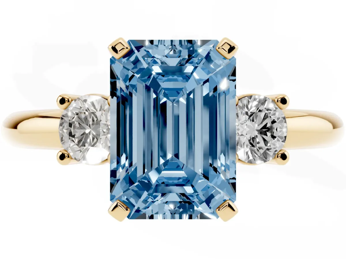 Fancy Blue Three-Stone Emerald Cut Cut Diamond Solitaire with Prong Setting and Classic Band Yellow gold