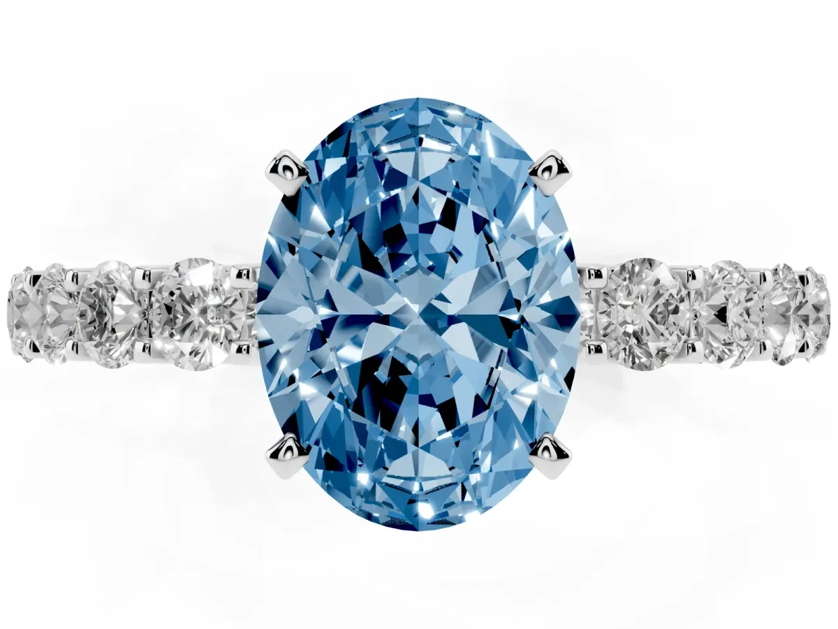 Fancy Blue Oval Cut Diamond Solitaire Ring with Shared Prong Pavé Band and Four-Prong Setting Silver