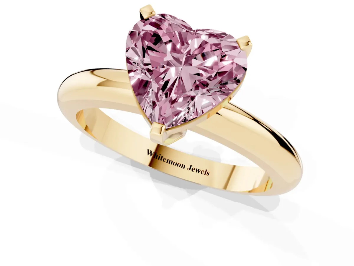 Fancy Pink Heart Cut Diamond Solitaire Engagement Ring with Round Band and Four-Prong Setting Yellow gold