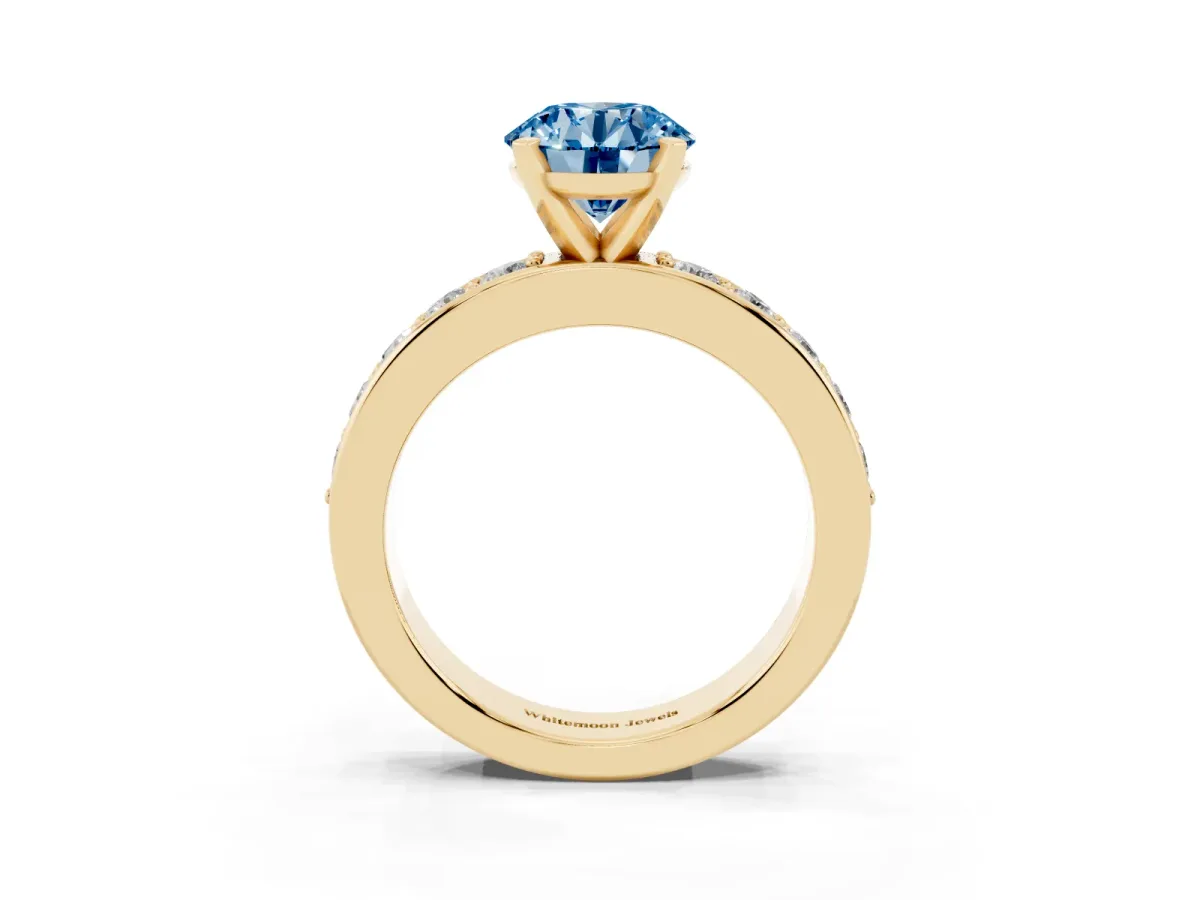 Fancy Blue Round Cut Diamond Engagement Ring with Channel Set Round Band and Prong Setting Yellow gold