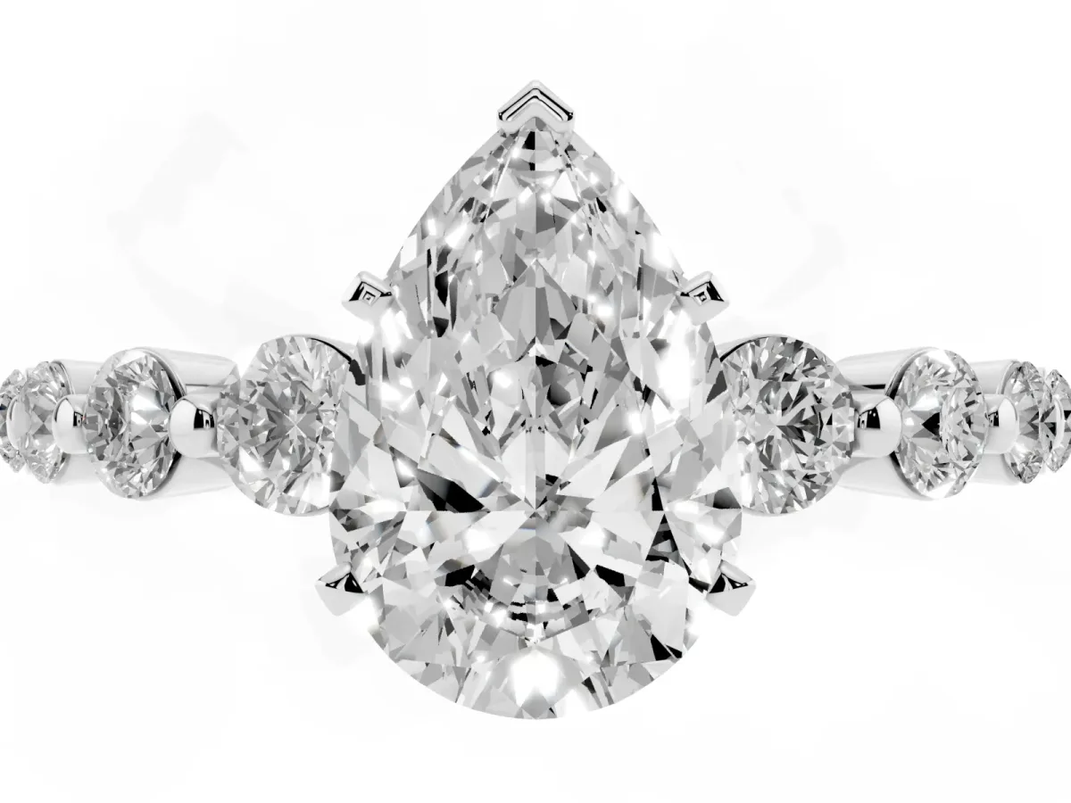 Pear Cut Solitaire Diamond Ring with Pave Band and Four-Prong Setting Silver