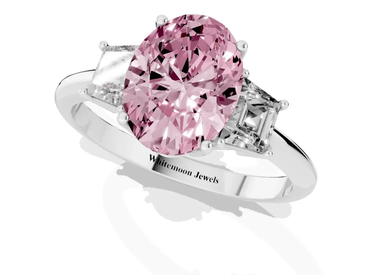 Fancy Pink Oval Cut Diamond Three-Stone Ring with Trapezoid Side Stones and Prong Setting Silver