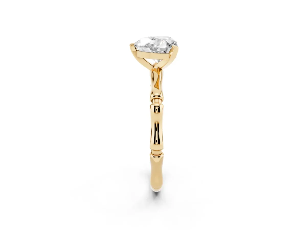 Heart Cut Solitaire Diamond Ring with Bamboo Band and Four-Prong Setting Yellow gold