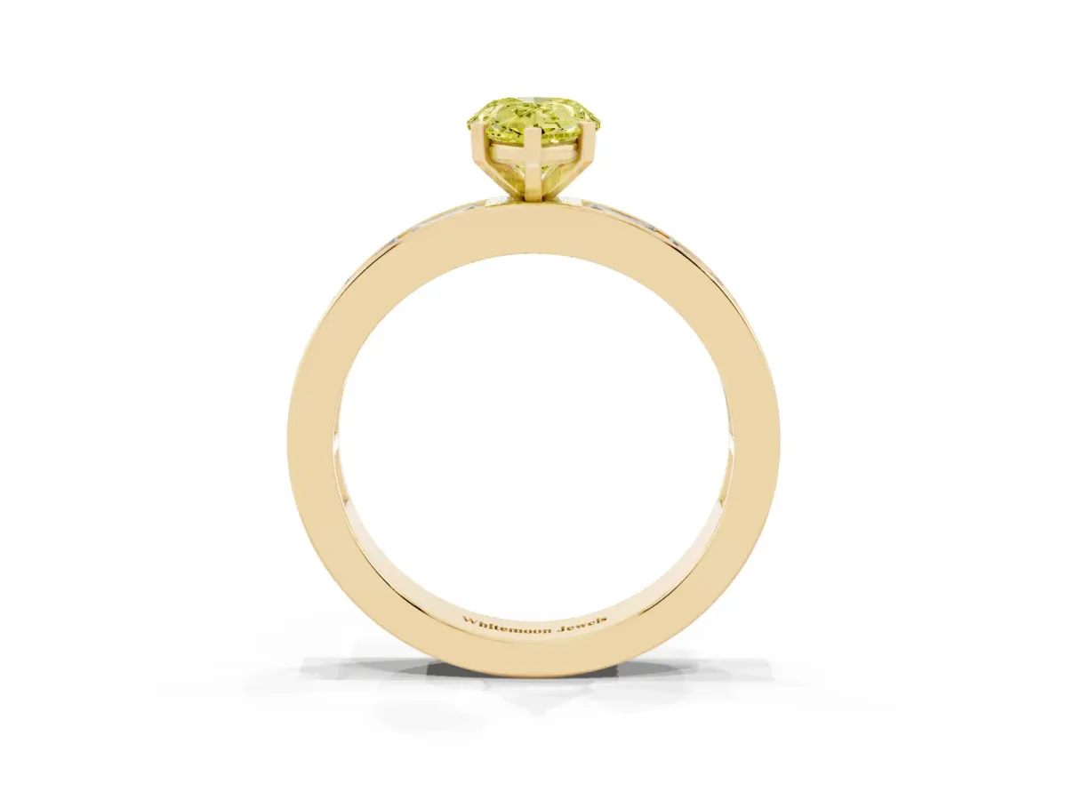 Fancy Yellow Pear Cut Solitaire Diamond Ring with Channel-Set Baguette Band and Four-Prong Setting Yellow gold