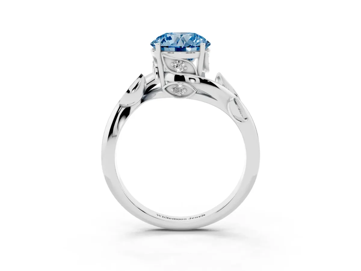 Fancy Blue Round Cut Solitaire Twist Engagement Ring with Leaf Accents and Prong Setting Silver