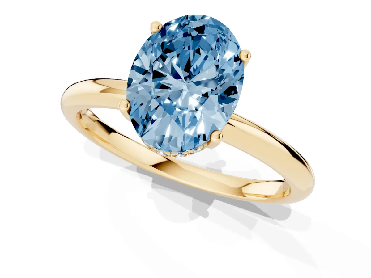 Fancy Blue Oval Cut Cut Solitaire Engagement Ring with Four-Prong Setting and Classic Band Yellow gold