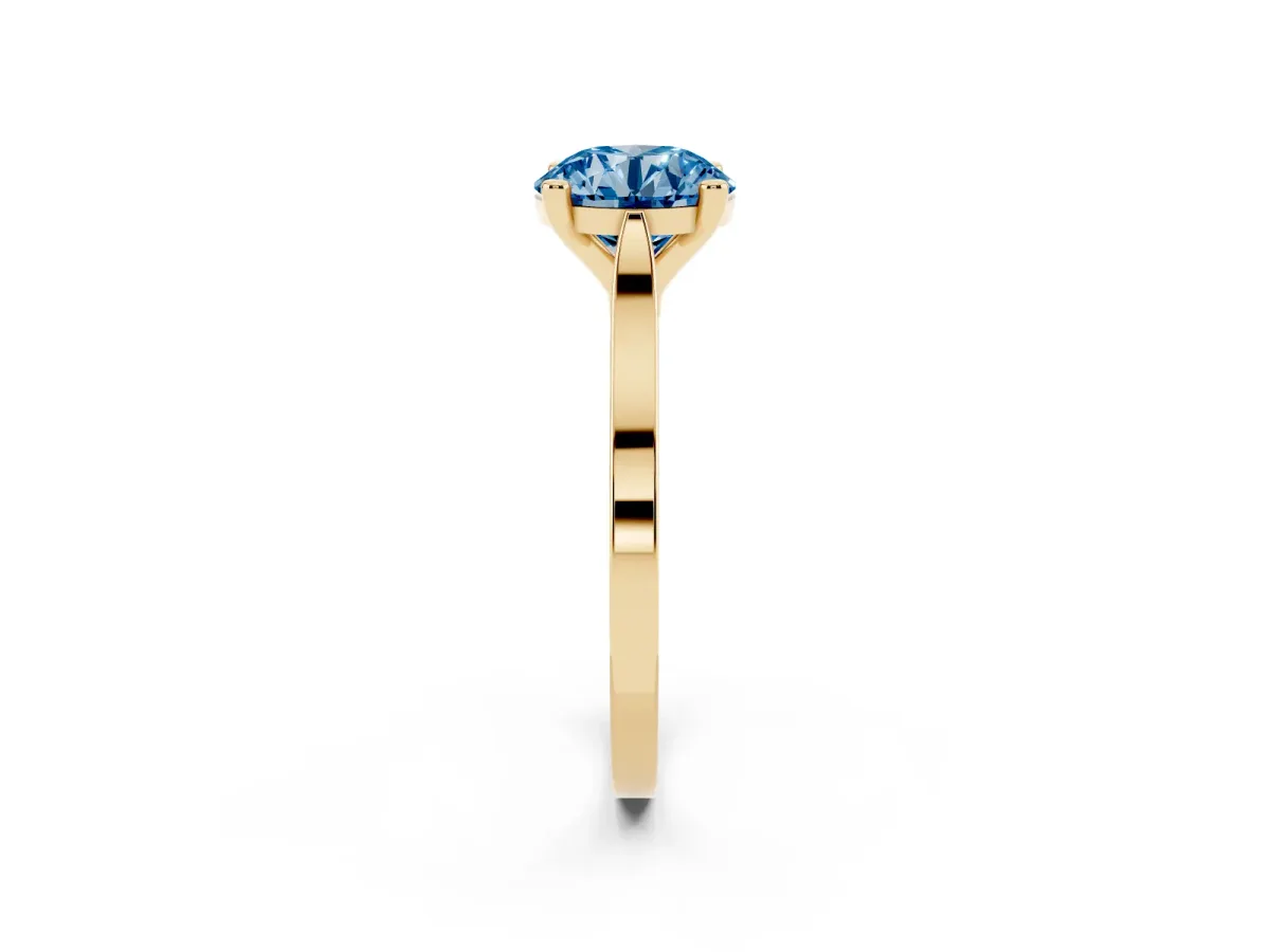 Fancy Blue Round Cut Solitaire Diamond Ring with Four-Prong Setting and Tapered Band Yellow gold