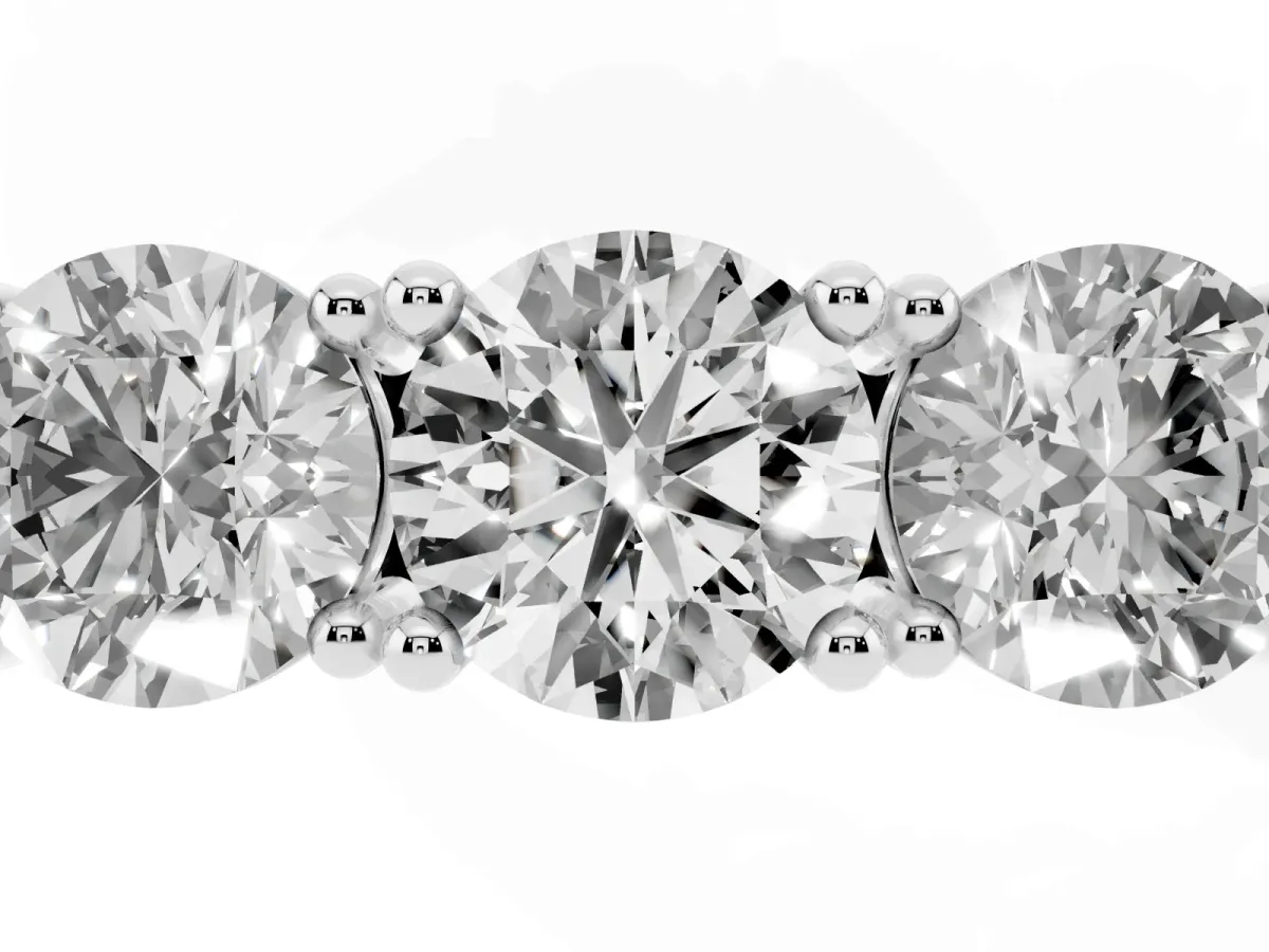 Three-Stone Round Cut Diamond Channel Band with Prong Setting Platinum