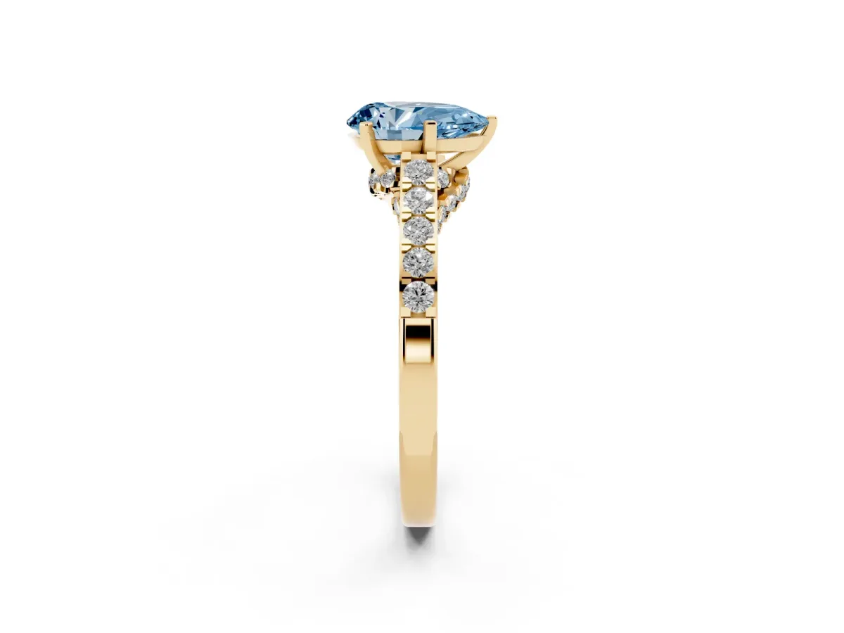 Fancy Blue Pear Cut Diamond Solitaire Ring with Crossover Gallery and Round Pavé Band Yellow gold