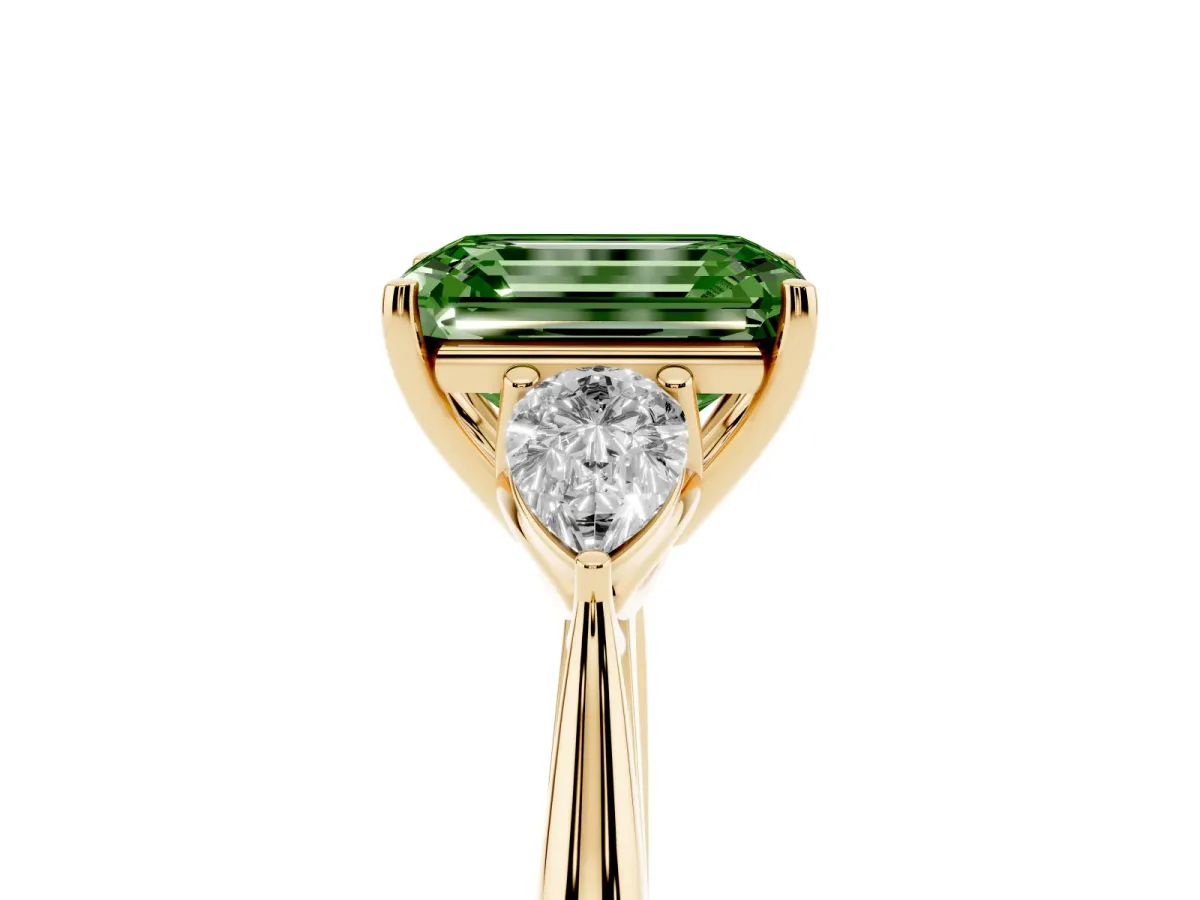 Fancy Green Three-Stone Emerald Cut Diamond Ring with Pear Side Stones in Four-Prong Setting Yellow gold