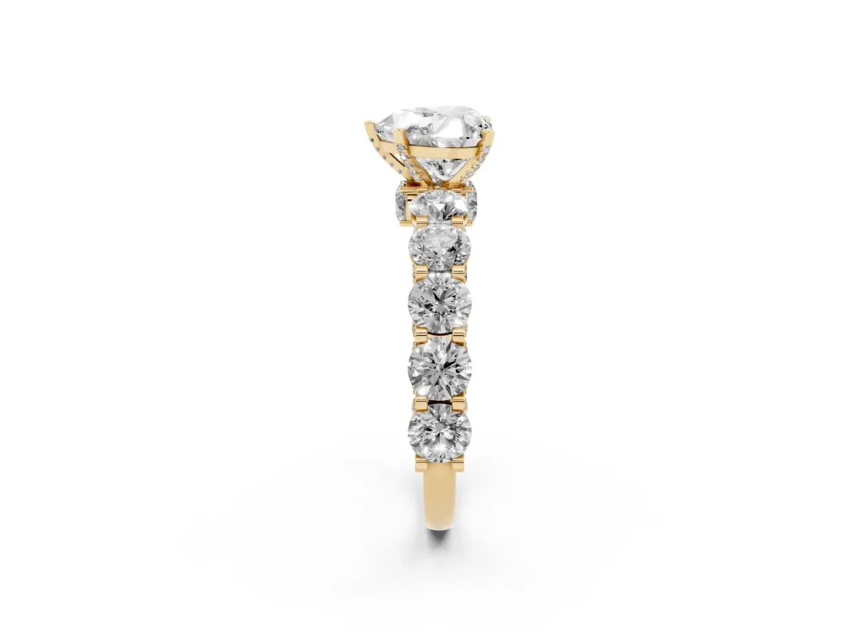 Heart Cut Diamond Side Stone Engagement Ring with Four-Prong Setting Yellow gold