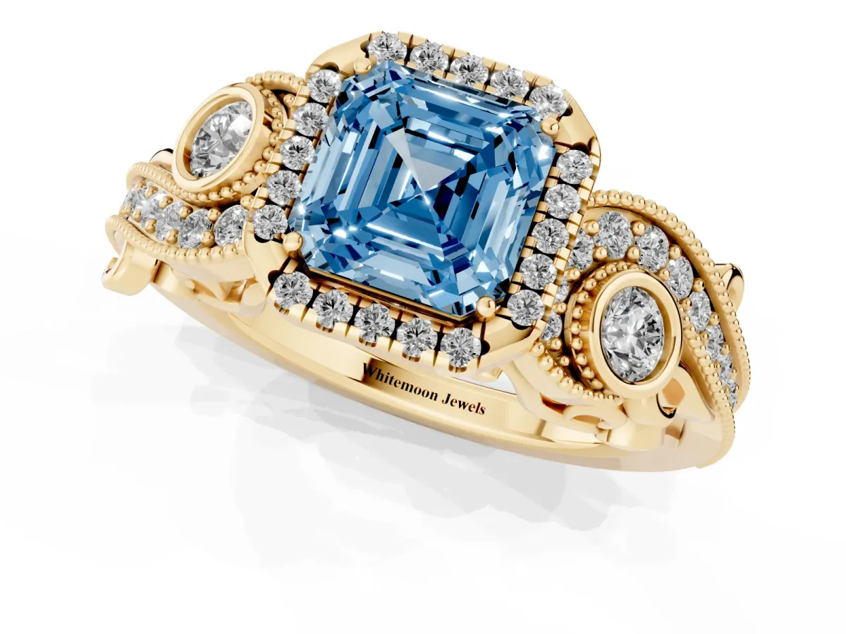 Fancy Blue Asscher Cut Halo Diamond Ring with Milgrain and Bezel Accents on a Split Shank Band Yellow gold