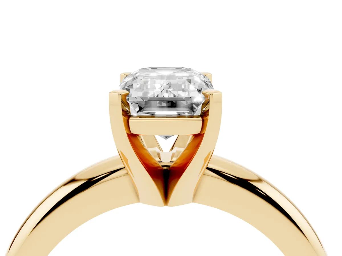 Emerald Cut Diamond Solitaire Engagement Ring with Round Band and Four-Prong Setting Yellow gold