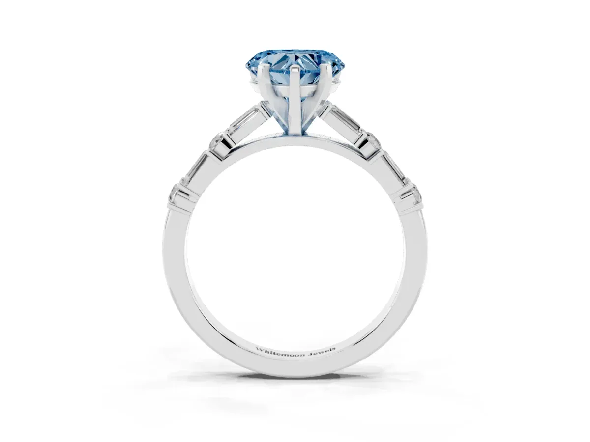 Fancy Blue Heart Cut Diamond Solitaire with Side Baguettes and Channel Set Band Silver