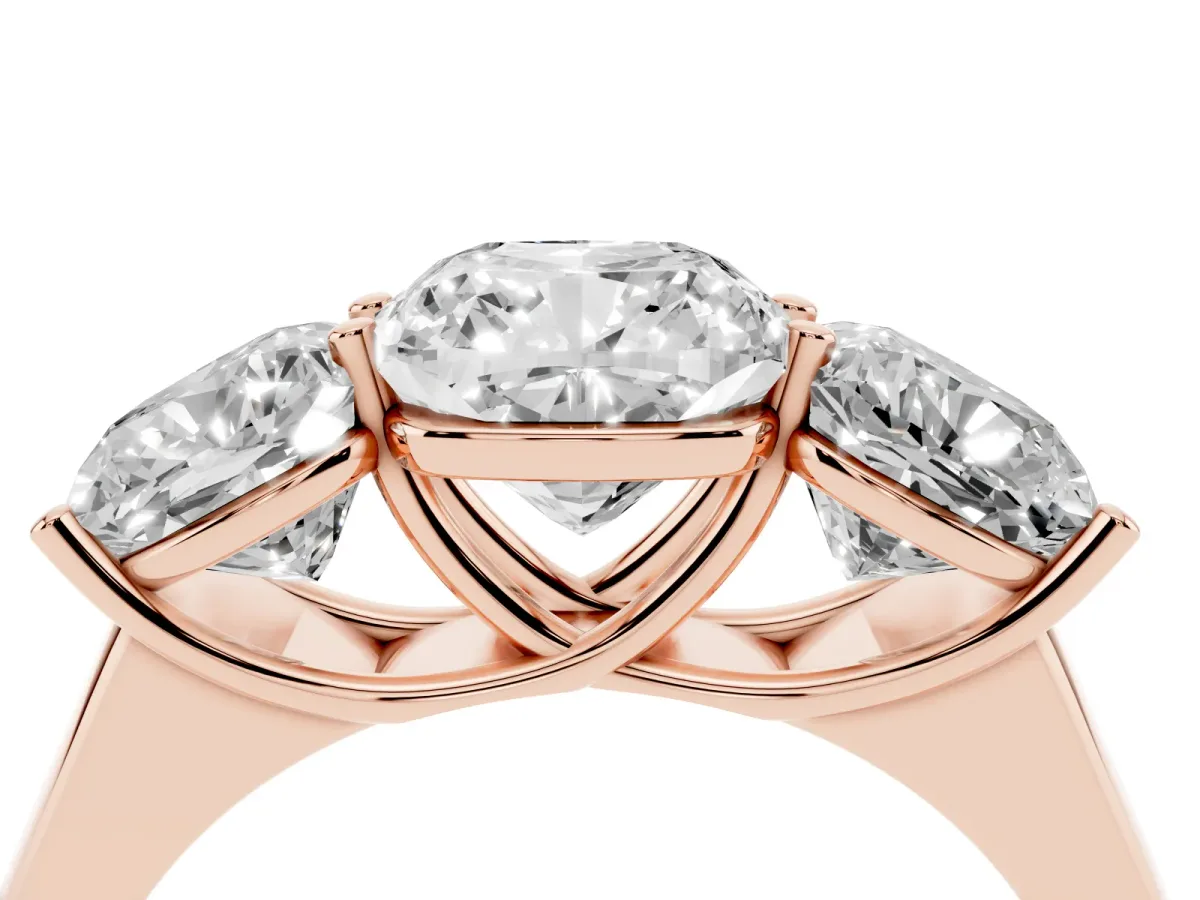 Cushion Cut Three-Stone Diamond Ring with Prong Setting on a Classic Band Rose gold
