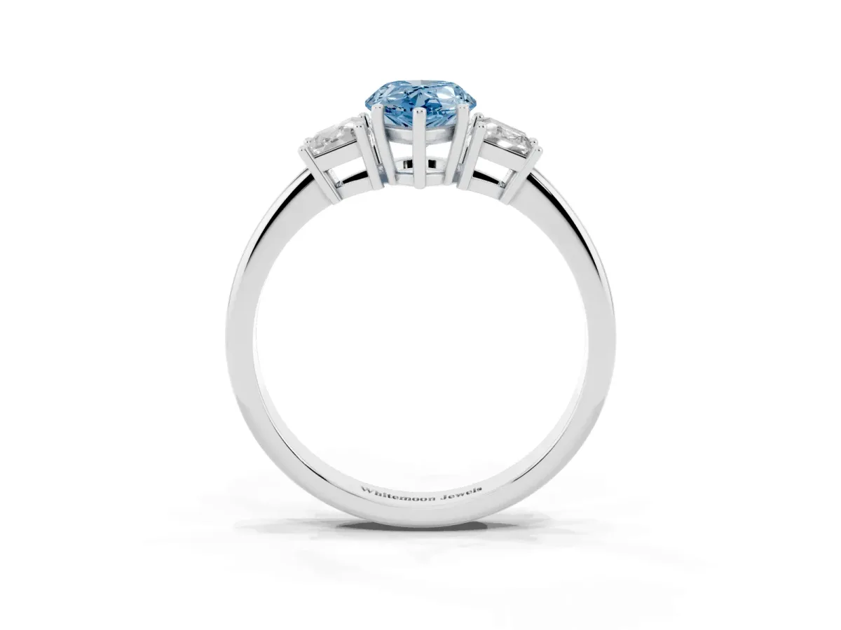 Fancy Blue Pear Cut Diamond Three-Stone Ring with Trapezoid Side Stones and Prong Setting Platinum