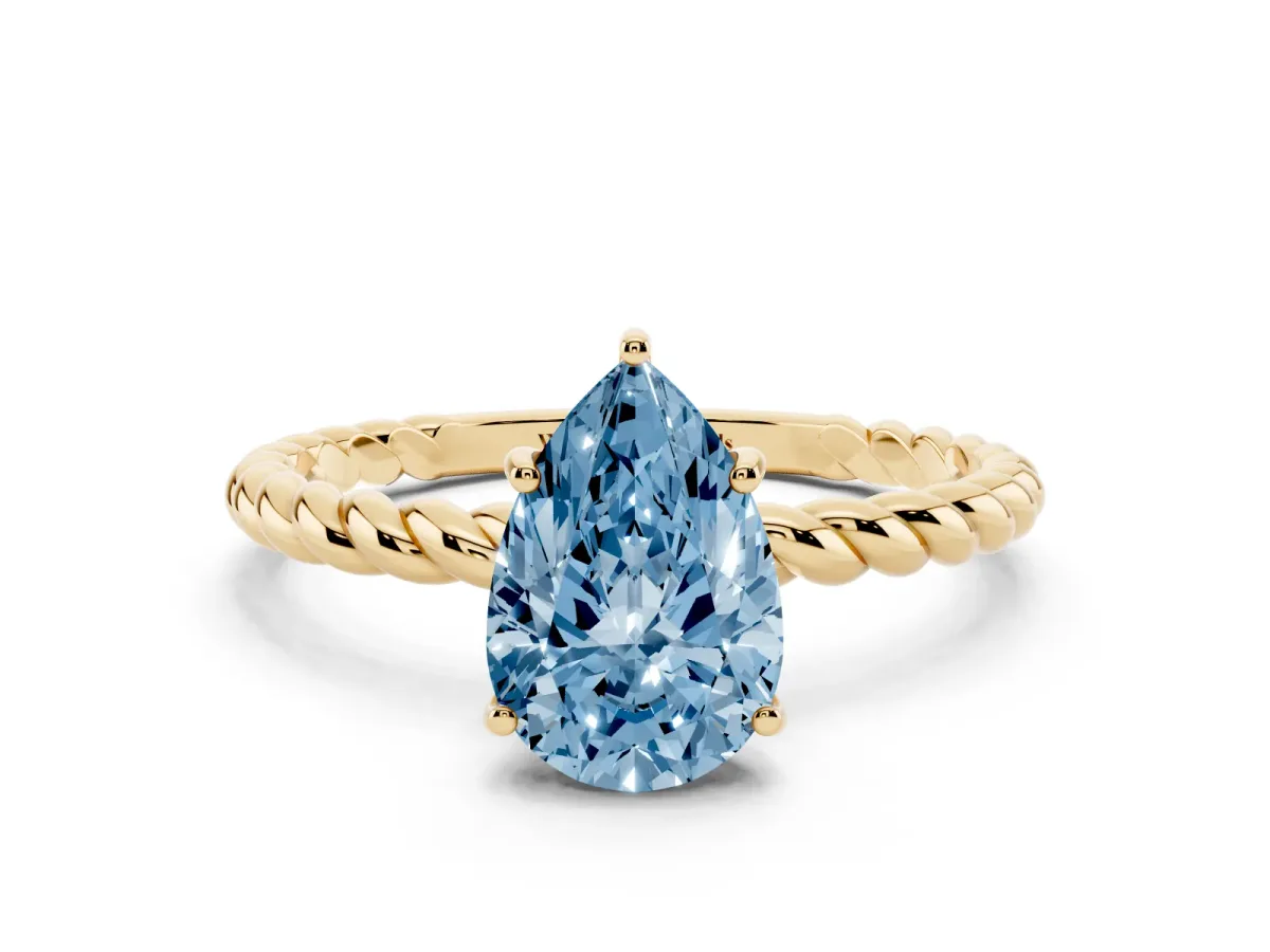 Fancy Blue Pear Cut Solitaire Twist Band Ring with Four-Prong Setting Yellow gold