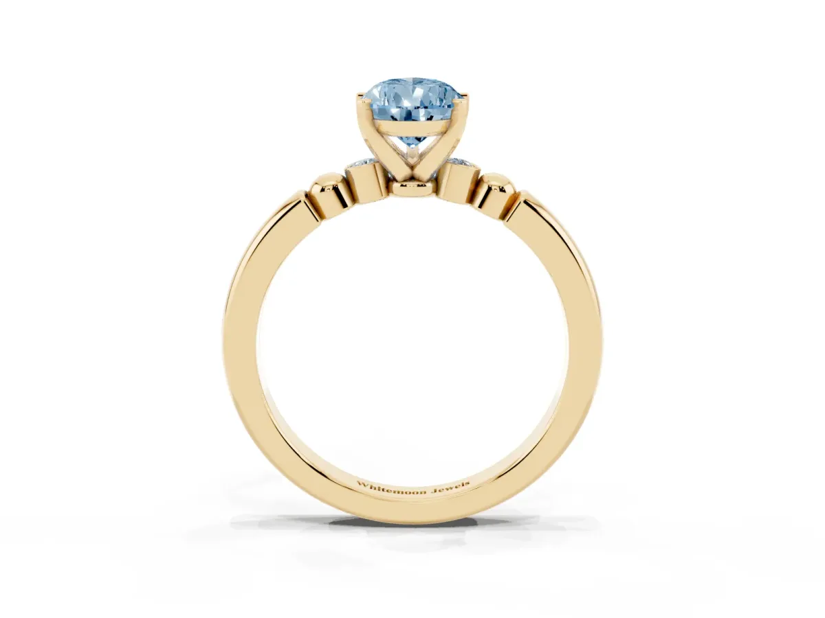 Fancy Blue Pear Cut Solitaire Beaded Band with Four-Prong Setting Yellow gold