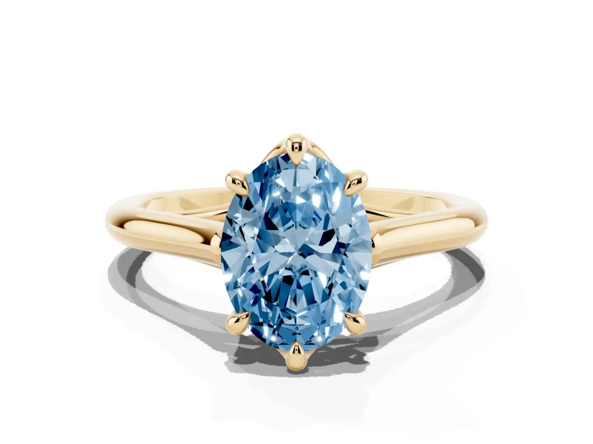 Fancy Blue Oval Cut Solitaire Engagement Ring with Six-Prong Setting and Classic Band Yellow gold