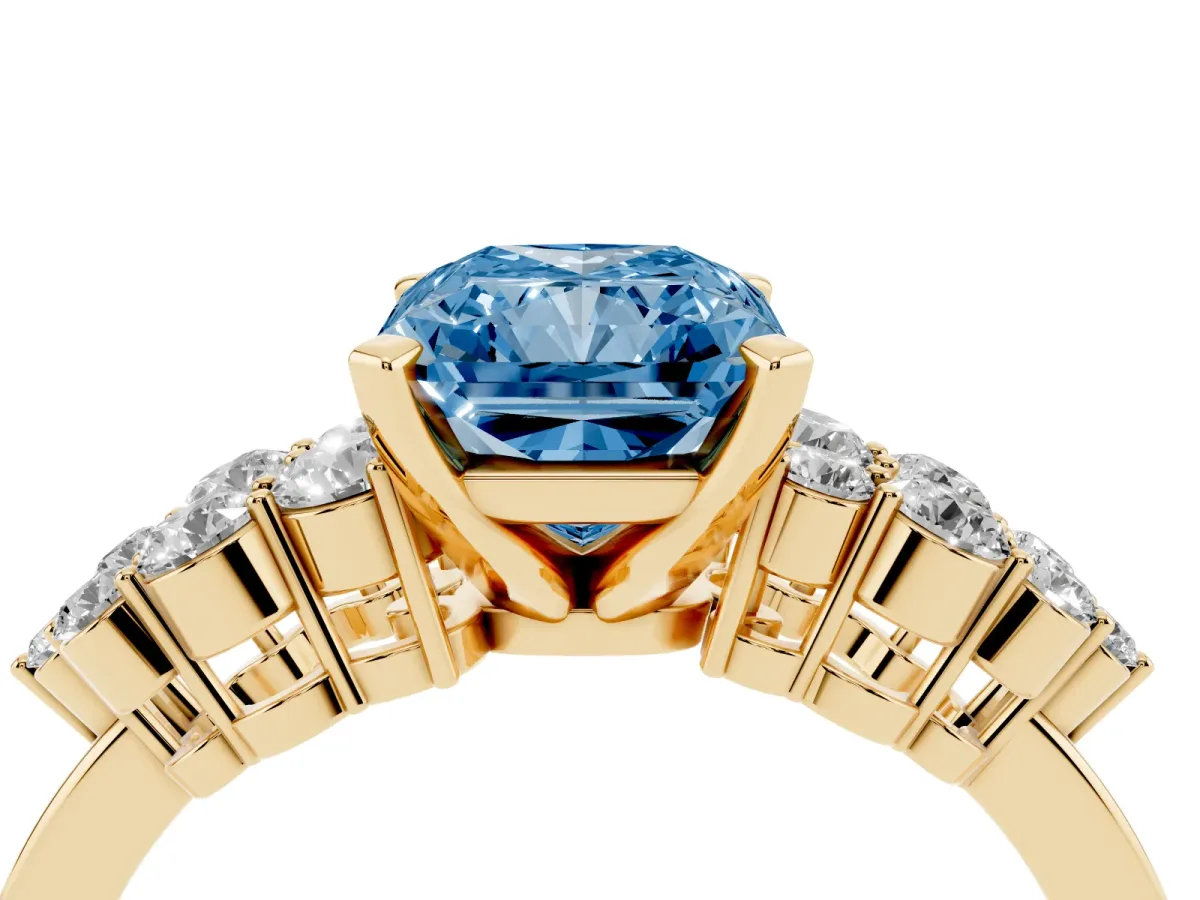 Fancy Blue Radiant Cut Cluster Diamond Engagement Ring with Pavé Band and Four-Prong Setting Yellow gold