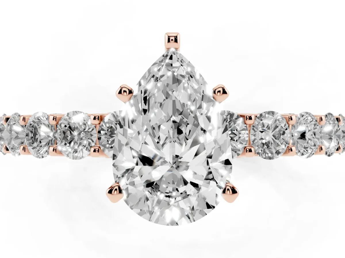 Pear Cut Diamond Solitaire Ring with Shared Prong Pavé Band and Four-Prong Setting Rose gold