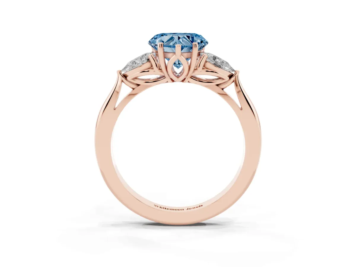 Fancy Blue Heart Cut Diamond Three-Stone Ring with Pear Side Stones and Prong Setting Rose gold