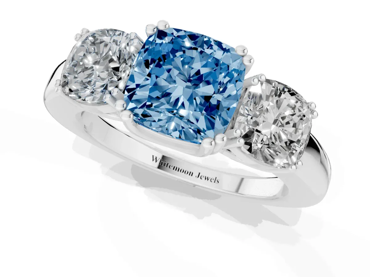 Fancy Blue Three-Stone Cushion Cut Cut Diamond Ring with Channel Set Band and Four-Prong Setting Platinum