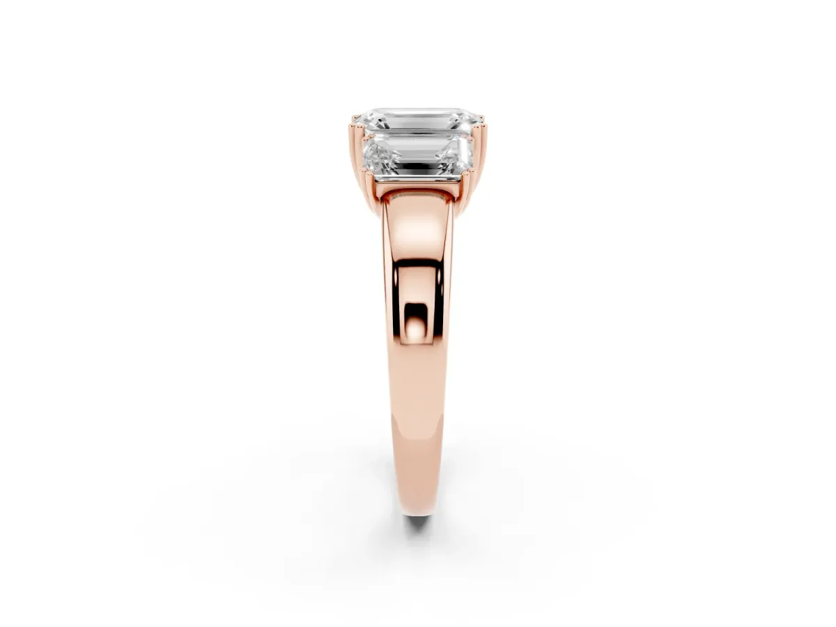 Three-Stone Emerald Cut Cut Diamond Ring with Channel Set Band and Four-Prong Setting Rose gold