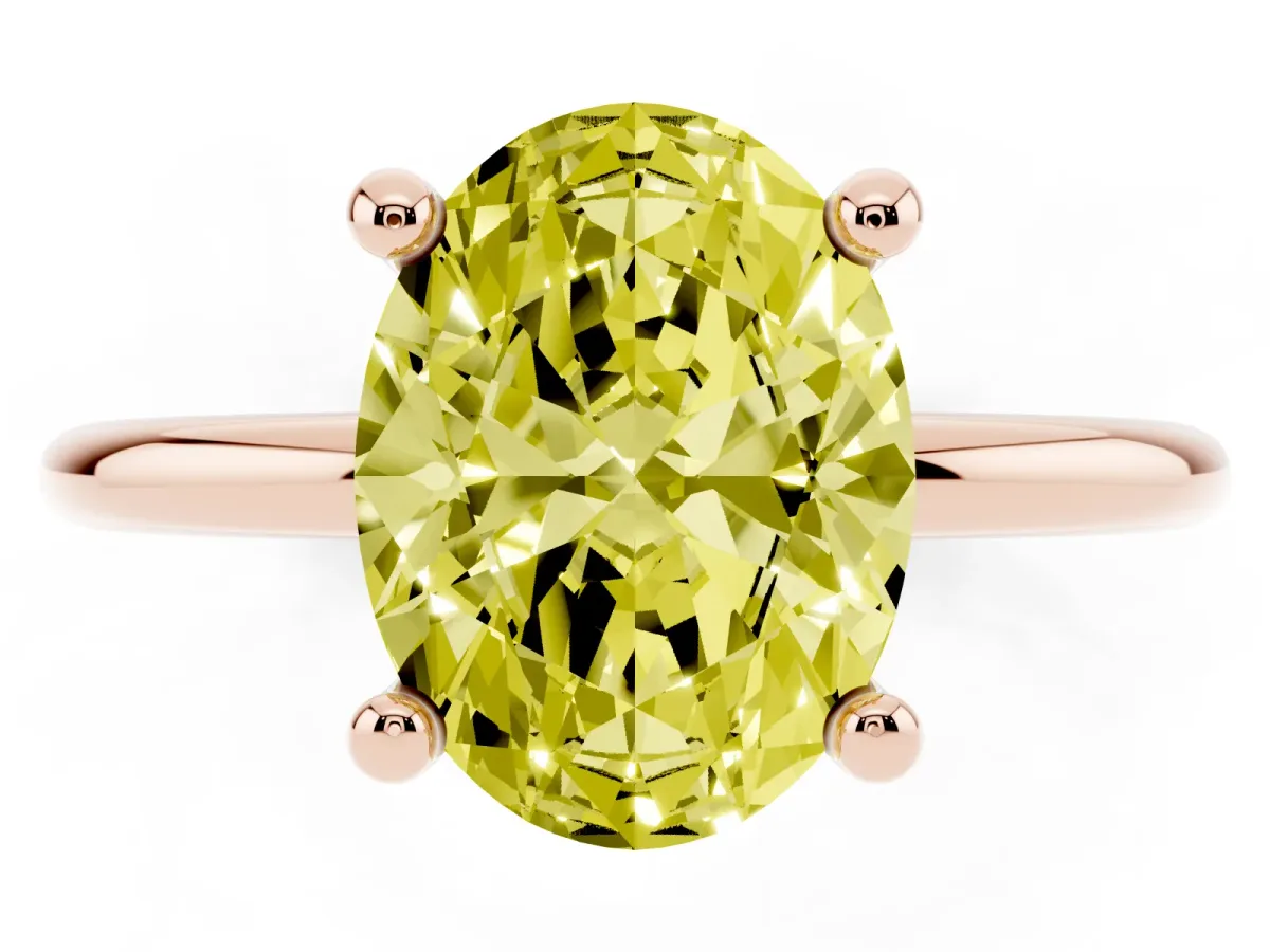 Fancy Yellow Oval Cut Solitaire Diamond Ring with 4-Prong Setting on a Classic Band Rose gold