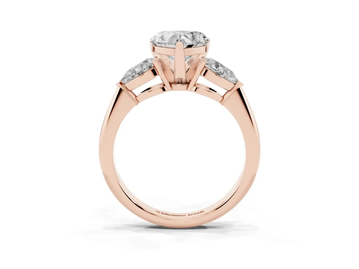 Three-Stone Heart Cut Diamond Ring with Pear Side Stones and Four-Prong Setting Rose gold