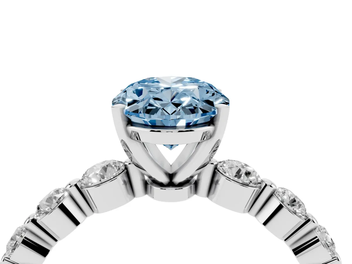 Fancy Blue Oval Cut Solitaire Diamond Ring with Pave Band and Four-Prong Setting Silver