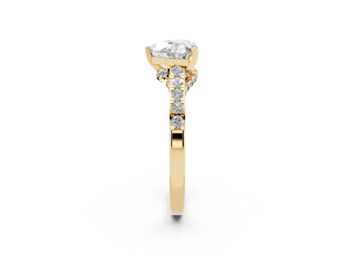 Heart Cut Diamond Solitaire Ring with Crossover Gallery and Round Pavé Band Yellow gold