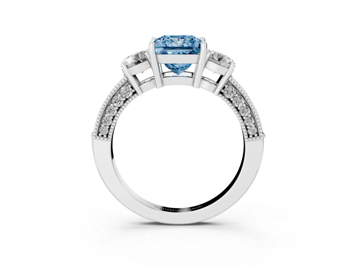 Fancy Blue Princess Cut Three-Stone Diamond Ring with Pavé Band and Four-Prong Setting Silver