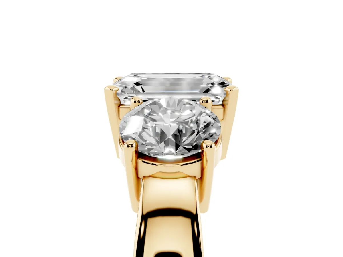 Three-Stone Emerald Cut Diamond Ring with Round Side Stones, Classic Band, and Four-Prong Setting Yellow gold