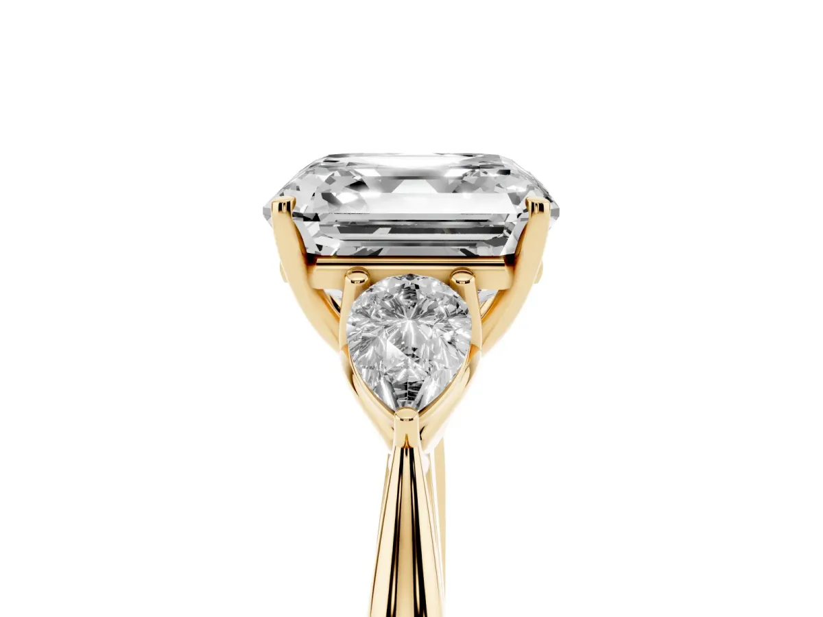 Asscher Cut Diamond Three-Stone Ring with Pear Side Stones and Prong Setting Yellow gold