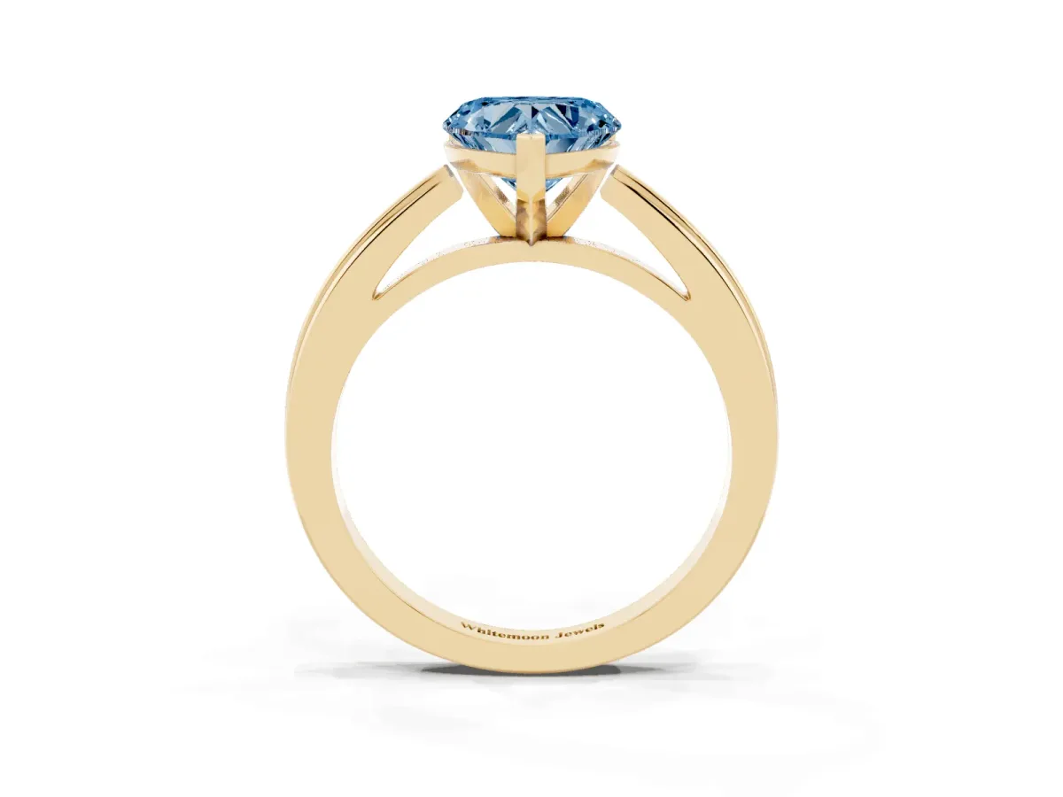 Fancy Blue Heart Cut Solitaire Diamond Ring with Four-Prong Setting and Classic Band Yellow gold