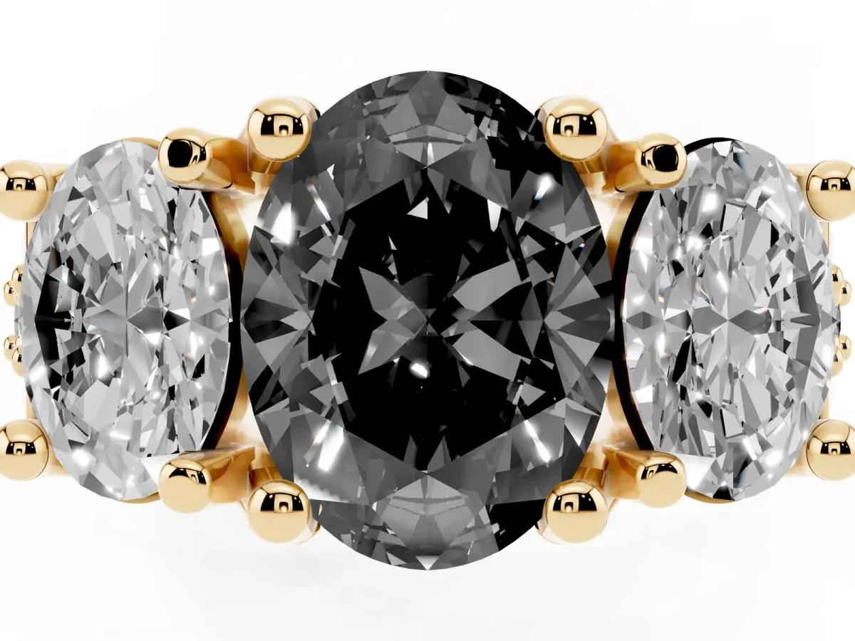 Fancy Black Oval Cut Diamond Three-Stone Ring with Channel Set Band and Four-Prong Setting Yellow gold