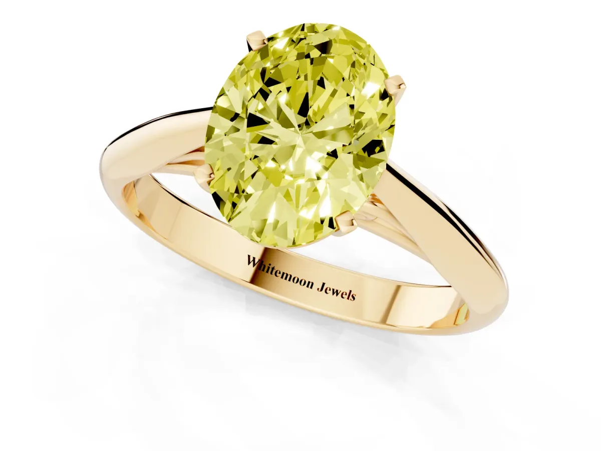 Fancy Yellow Oval Cut Diamond Solitaire Engagement Ring with Cathedral Setting and Four-Prong Mount Yellow gold