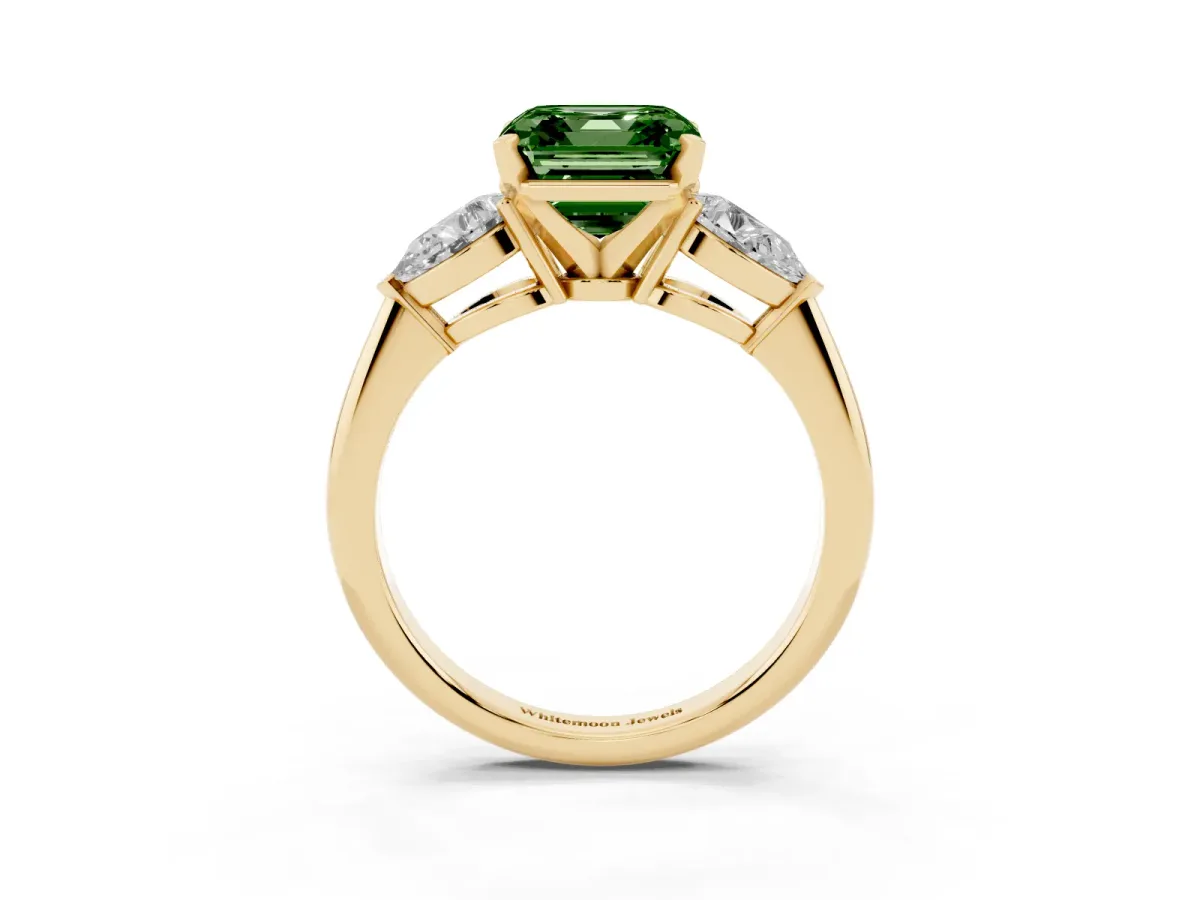 Fancy Green Three-Stone Asscher Cut Diamond Ring with Pear Side Stones and Four-Prong Setting Yellow gold