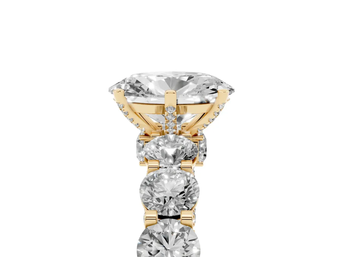 Oval Cut Diamond Side Stone Engagement Ring with Four-Prong Setting Yellow gold