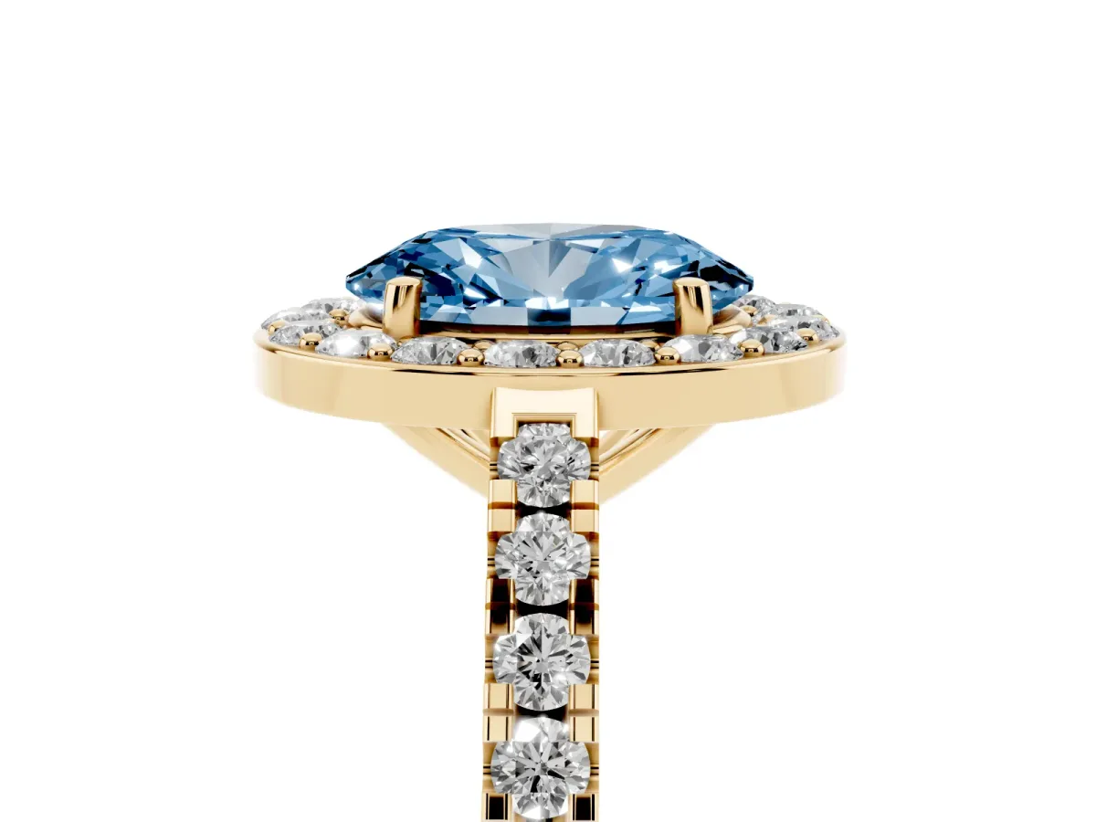 Fancy Blue Oval Cut Diamond Halo Ring with Round Pavé Split Shank and Prong Setting Yellow gold