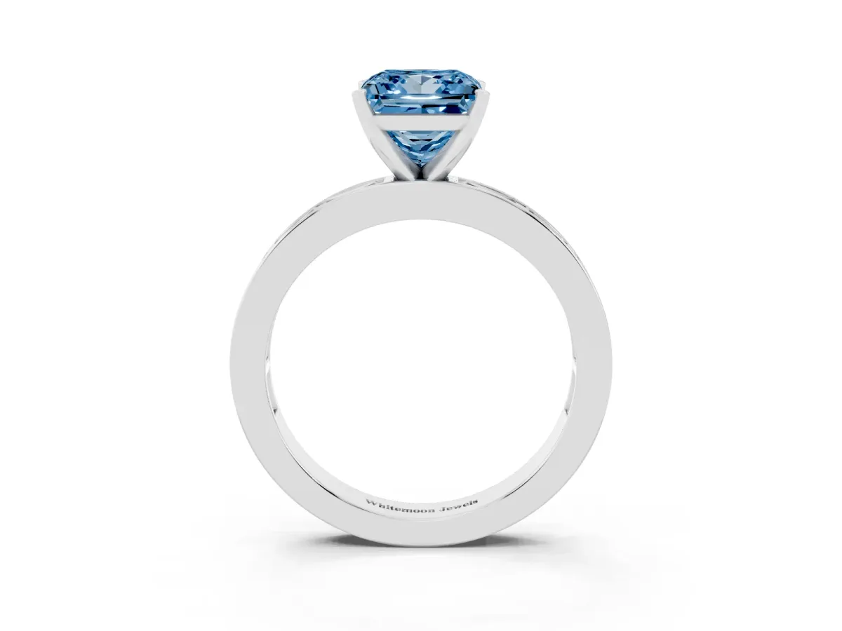 Fancy Blue Princess Cut Solitaire Diamond Ring with Channel-Set Baguette Band and Four-Prong Setting Platinum