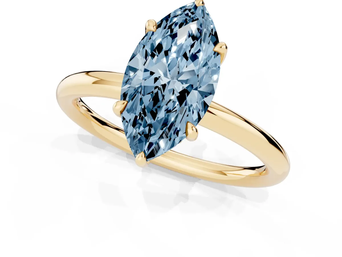 Fancy Blue Marquise Cut Diamond Solitaire Ring with Thin Band and Four-Prong Setting Yellow gold