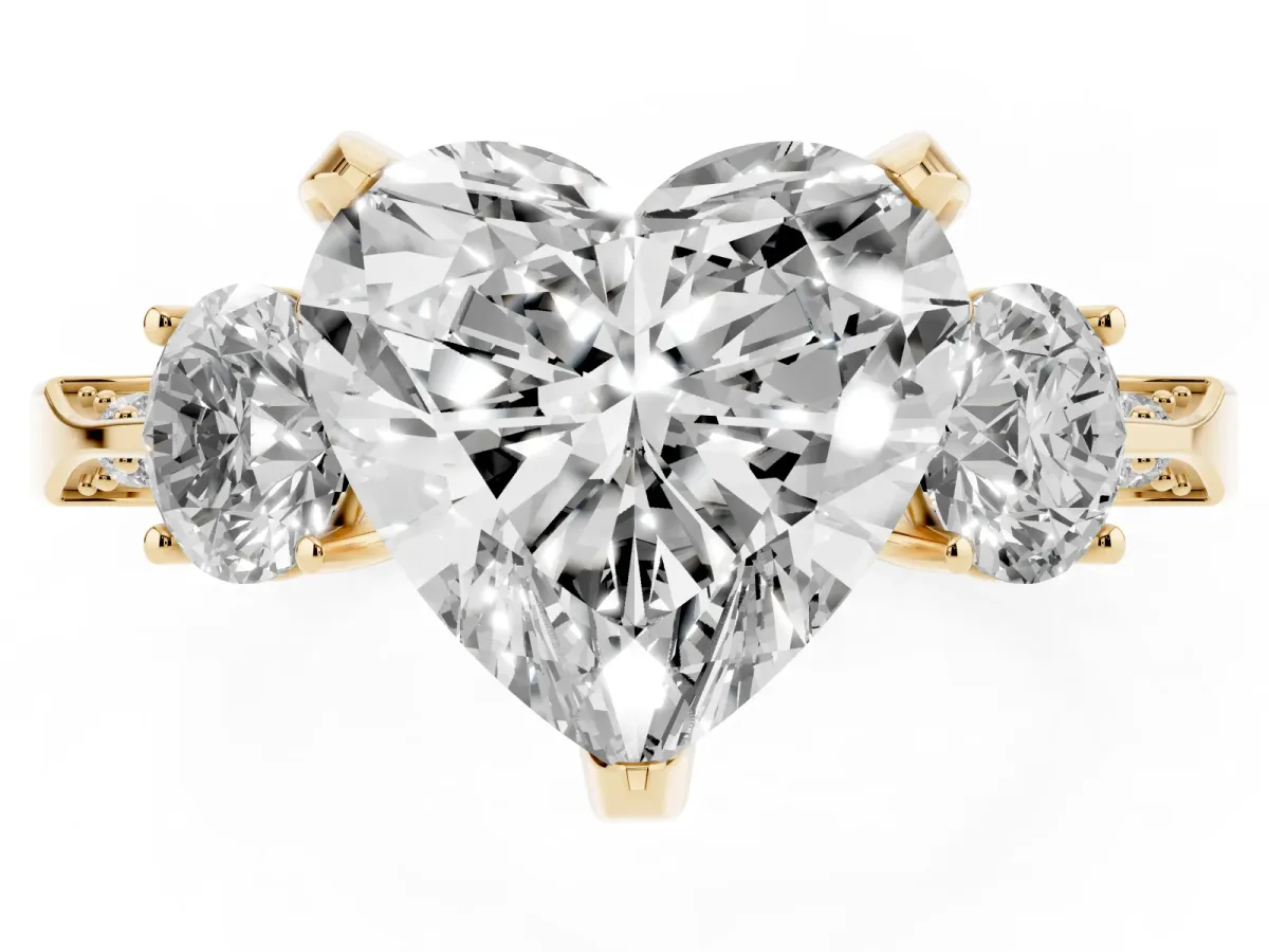 Heart Cut Brilliant Three-Stone Diamond Ring with Pavé Band and Four-Prong Setting Yellow gold