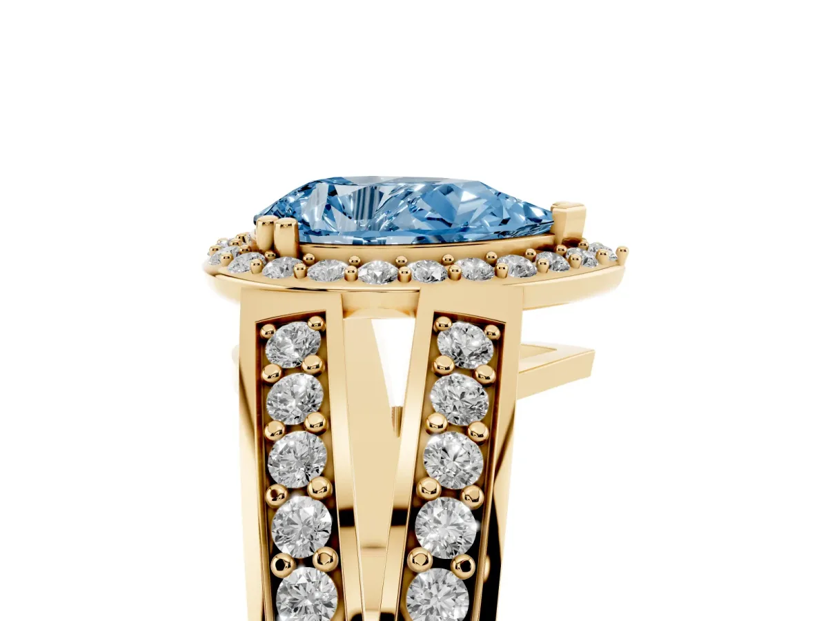 Fancy Blue Pear Cut Diamond Halo Ring with Split Shank Pavé Band and Four-Prong Setting Yellow gold
