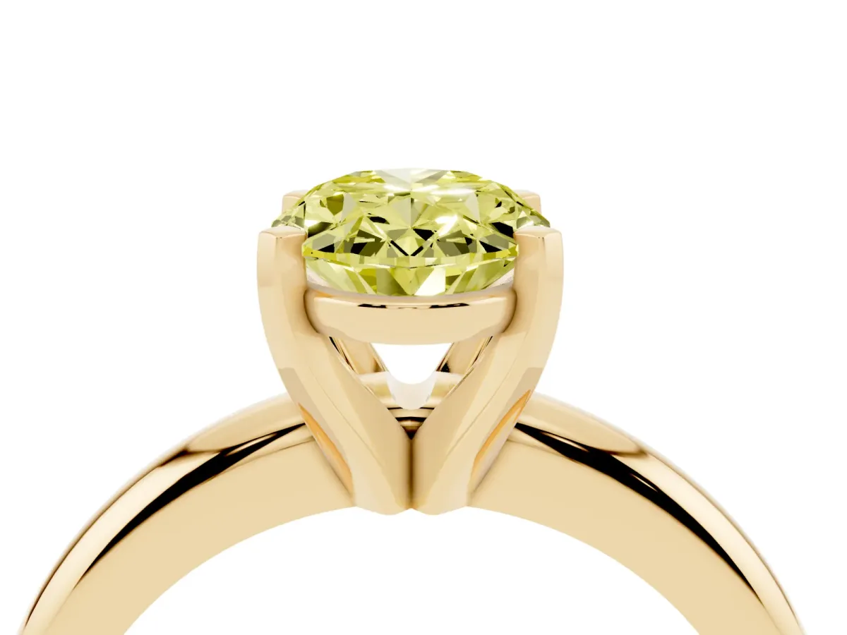 Fancy Yellow Oval Cut Diamond Solitaire Engagement Ring with Round Band and Four-Prong Setting Yellow gold