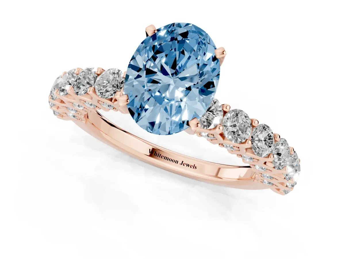Fancy Blue Oval Cut Diamond Solitaire Ring with Shared Prong Pavé Band and Four-Prong Setting Rose gold