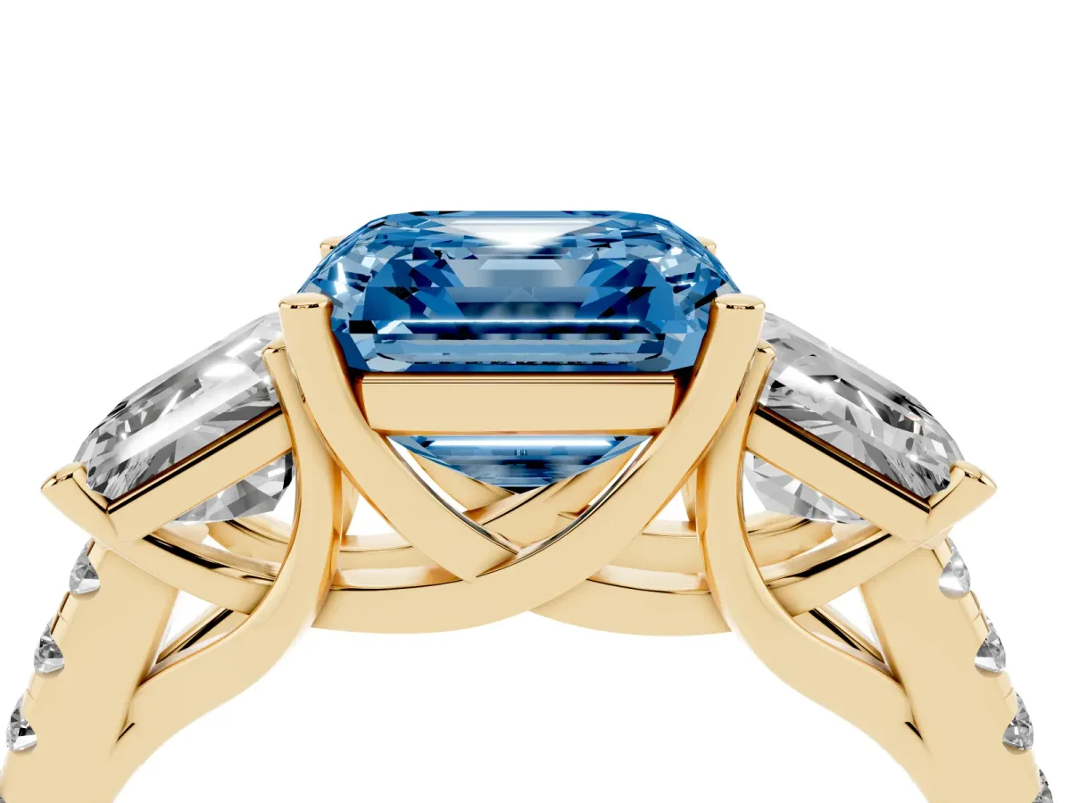 Fancy Blue Three-Stone Asscher Cut Diamond Ring with Round Pavé Band and Prong Setting Yellow gold